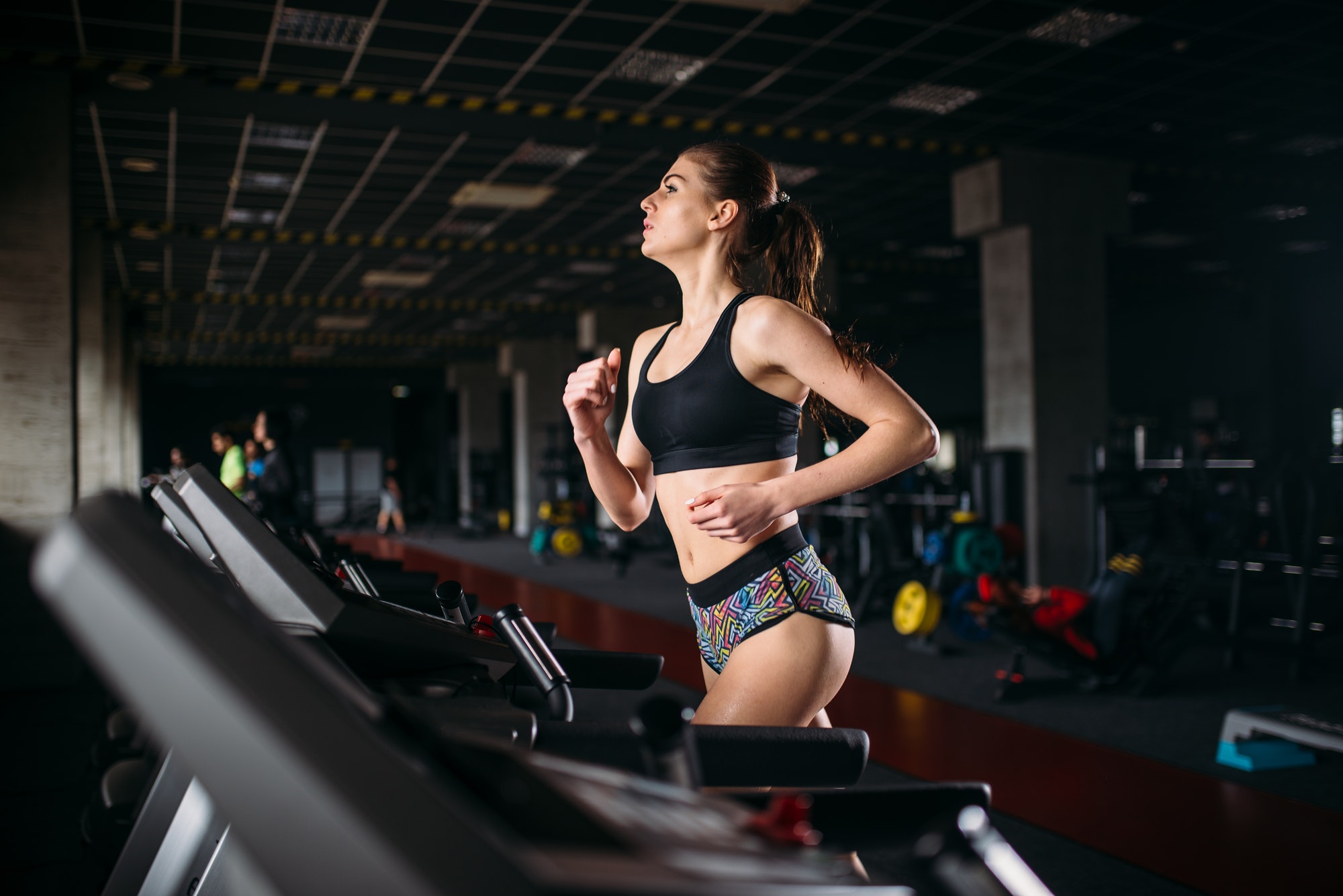 female-athlete-on-a-treadmill-in-sport-gym.jpg